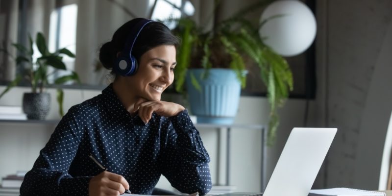 Woman looking at laptop