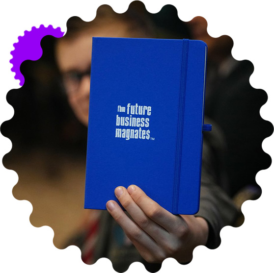 Student holding FBM branded notebook